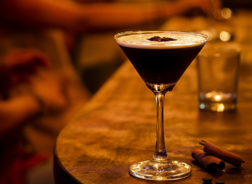 Espresso martini with coffee beans and cinnamon